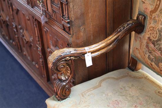 A pair of 19th century French Restauration style parcel gilt and carved beech armchairs, W.2ft 5in. D.2ft 3in. H.4ft 1in.